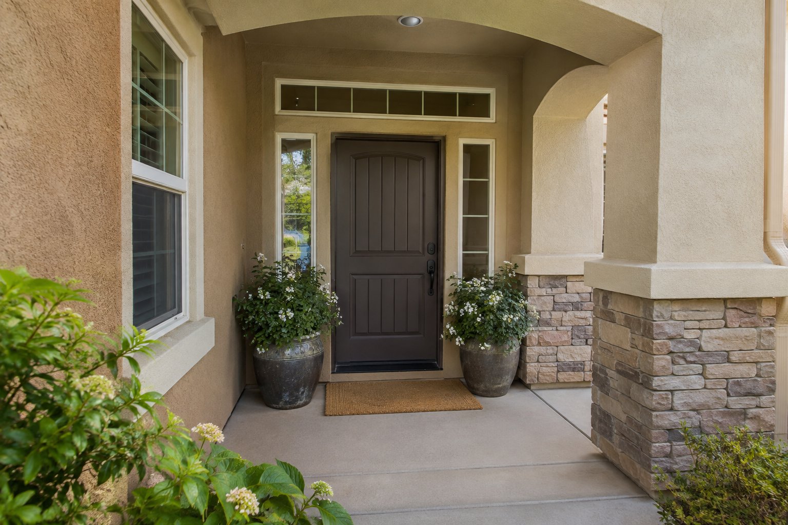 A covered front entry of a Modesto home, illustrative